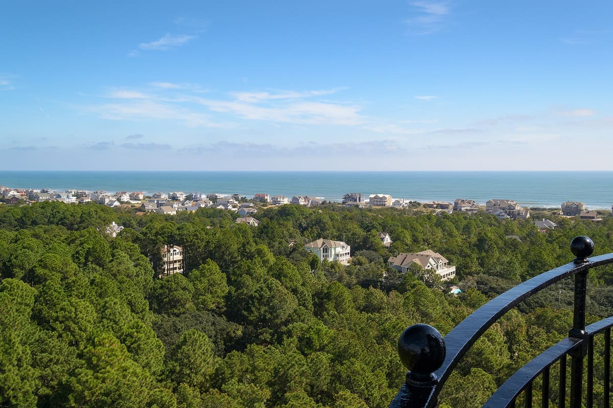 The rooftops of Corolla and the ocean beyond, seen from the lighthouse gallery
