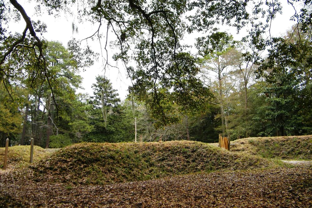 A sand path cut through the low reconstructed earthwork bank at Fort Raleigh