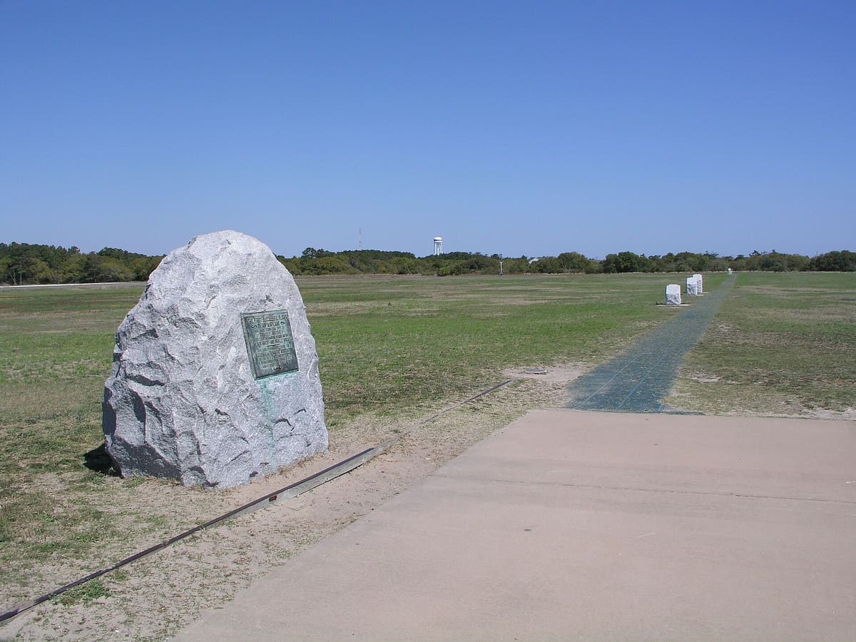The takeoff boulder with the numbered flight markers running away across the grass